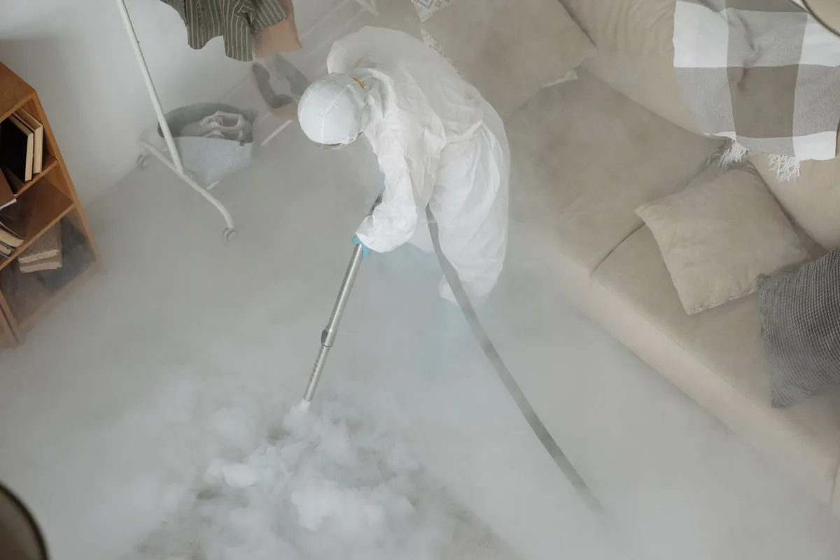Biohazard cleanup technician in protective equipment, Alexandria, LA